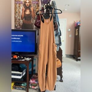 Free People Hot Shot onesie jumpsuit rusty orange color size medium